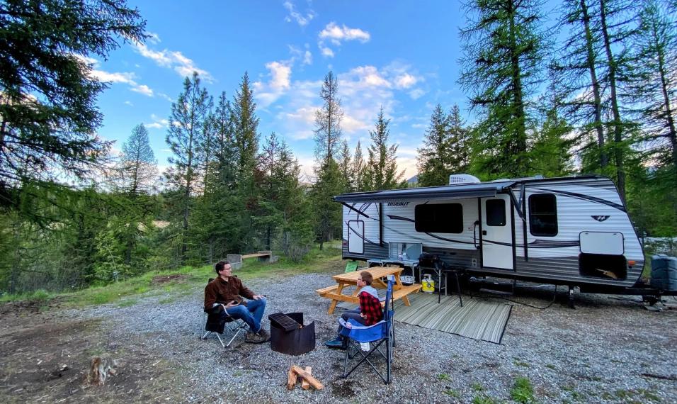 People in front of Camping Trailer