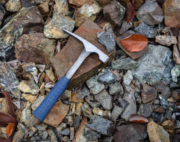 Rock pick geology rockhounding tool on rocks